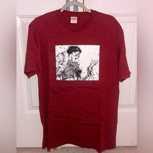 Supreme x Akira “Arm Tee” in burgundy.